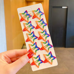 AIUPUOC clips in a Pride parade outfit showing festive, visible accessory