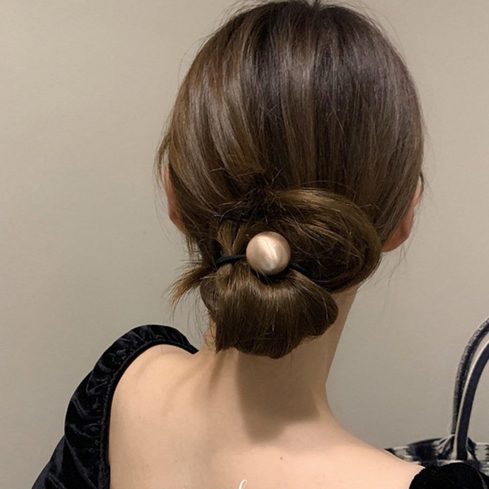AIUPUOC scrunchie on desk styled casually for everyday accessorizing