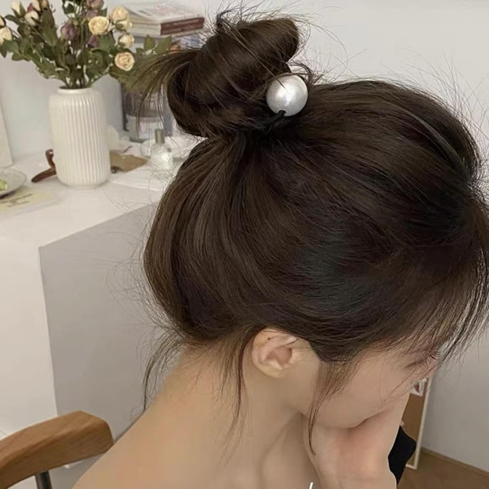 AIUPUOC scrunchie beside a coin revealing size and scale for sizing clarity benefit