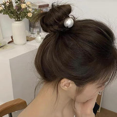 AIUPUOC scrunchie beside a coin revealing size and scale for sizing clarity benefit