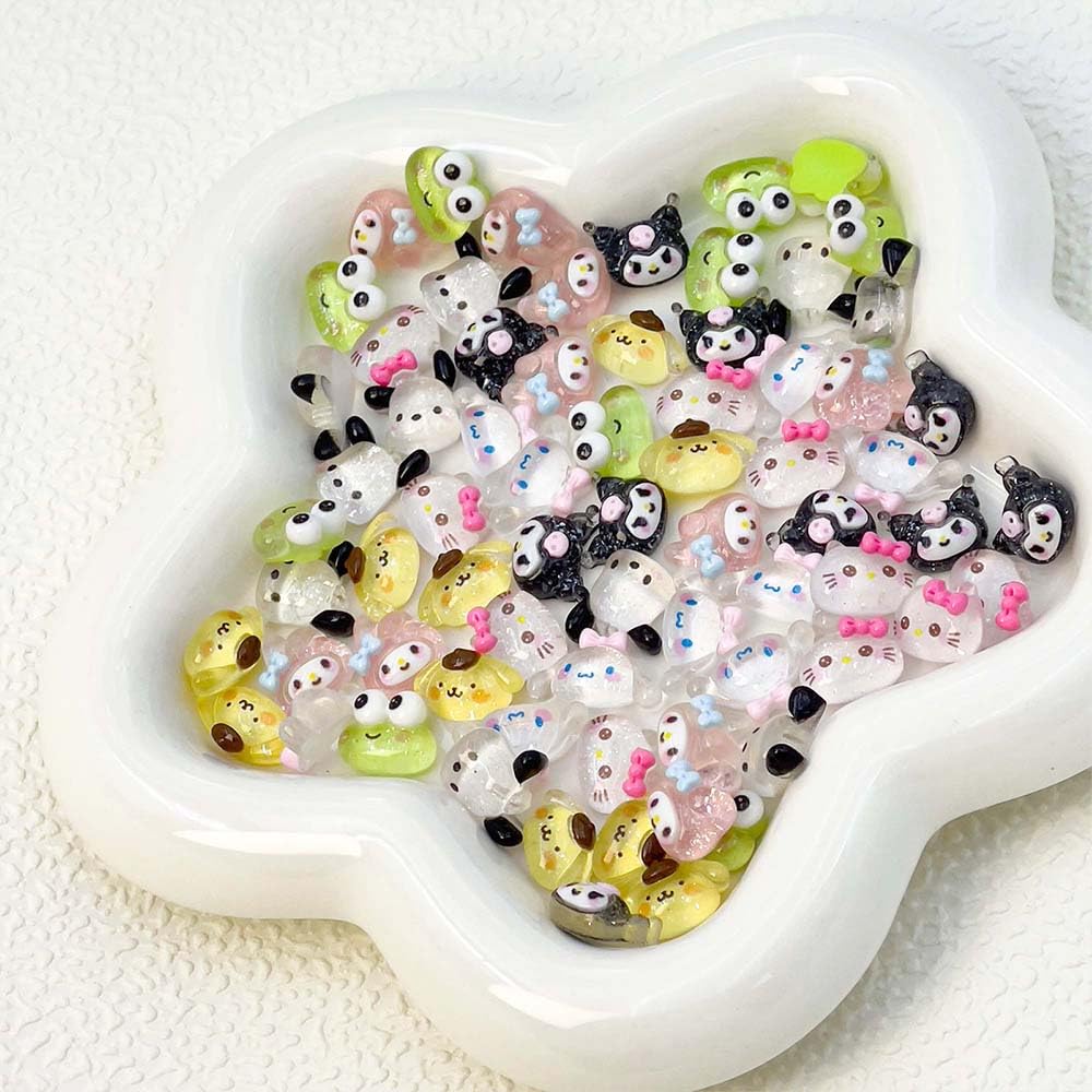 Akutoer charms beside ruler showing compact size benefit