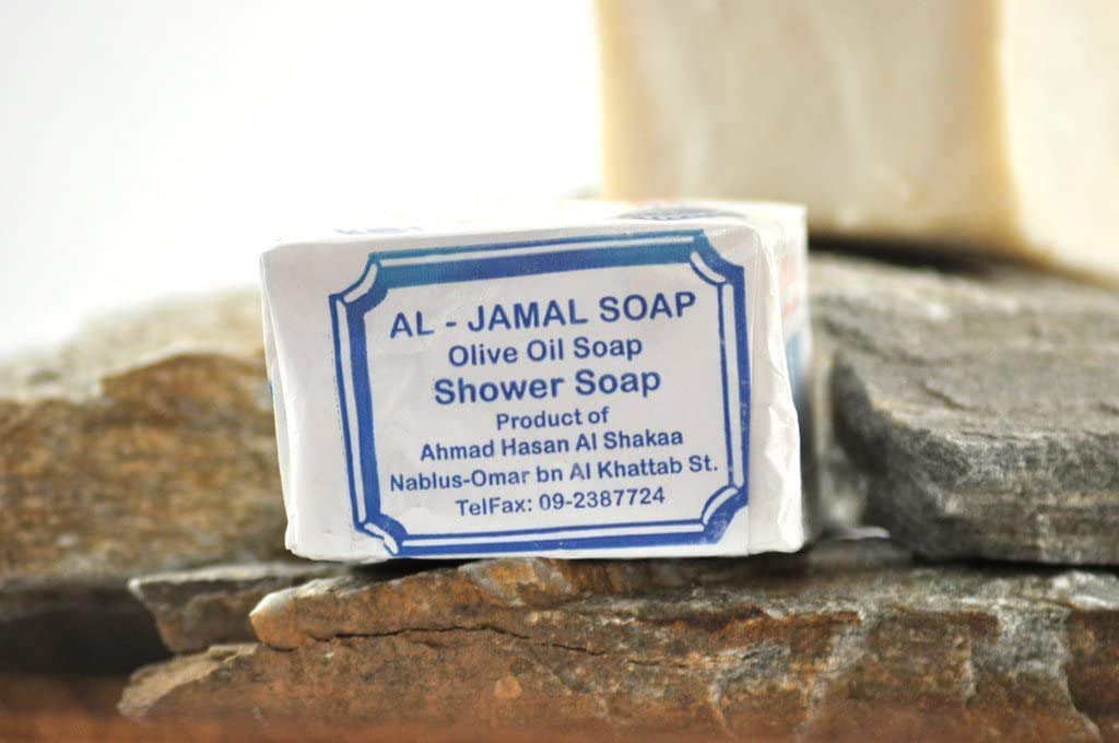 Close-up of Al-Jamal soap texture showing creamy olive-oil surface and gentle lather