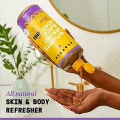 Alaffia 32 oz bottle next to a common object showing size and long-lasting supply