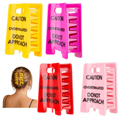 ALkrinox front packaging showing four colorful caution sign hair clips, playful gift-ready