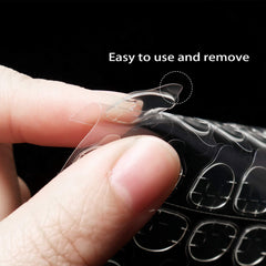 Allstarry hands applying a press-on using a tab demonstrating quick application