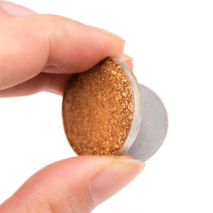 Allwon metal stickers attached to eyeshadow pans demonstrating secure fit for magnetic palettes