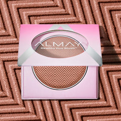 Almay close-up of blush pan texture showing smooth blendability benefit