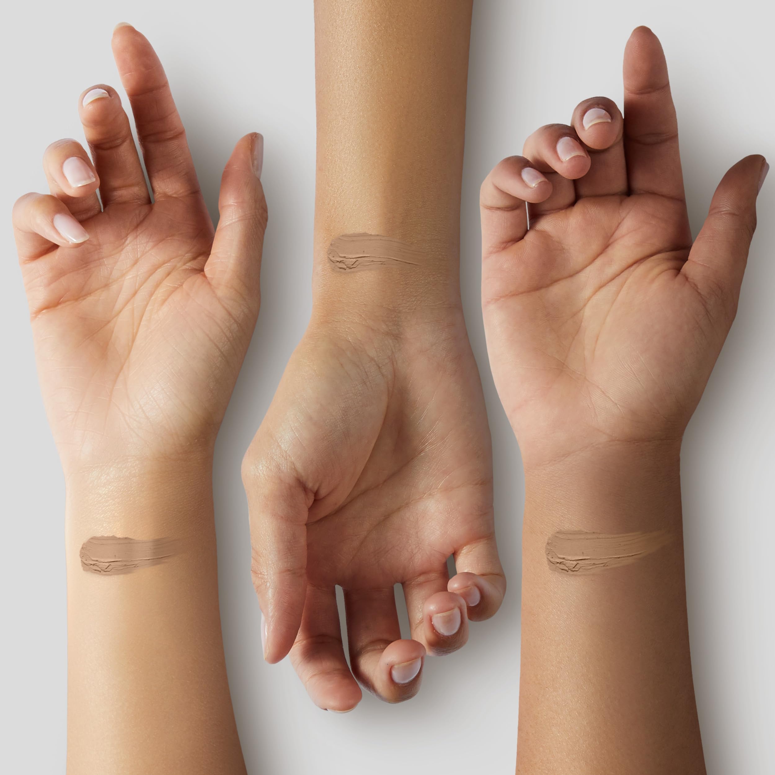 Almay blended swatch on hand showing color shift and buildable coverage benefit