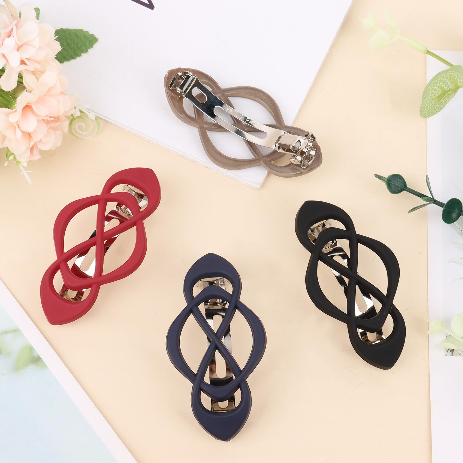 Amariver barrettes on a desk next to outfit showing quick on-the-go accessorizing benefit