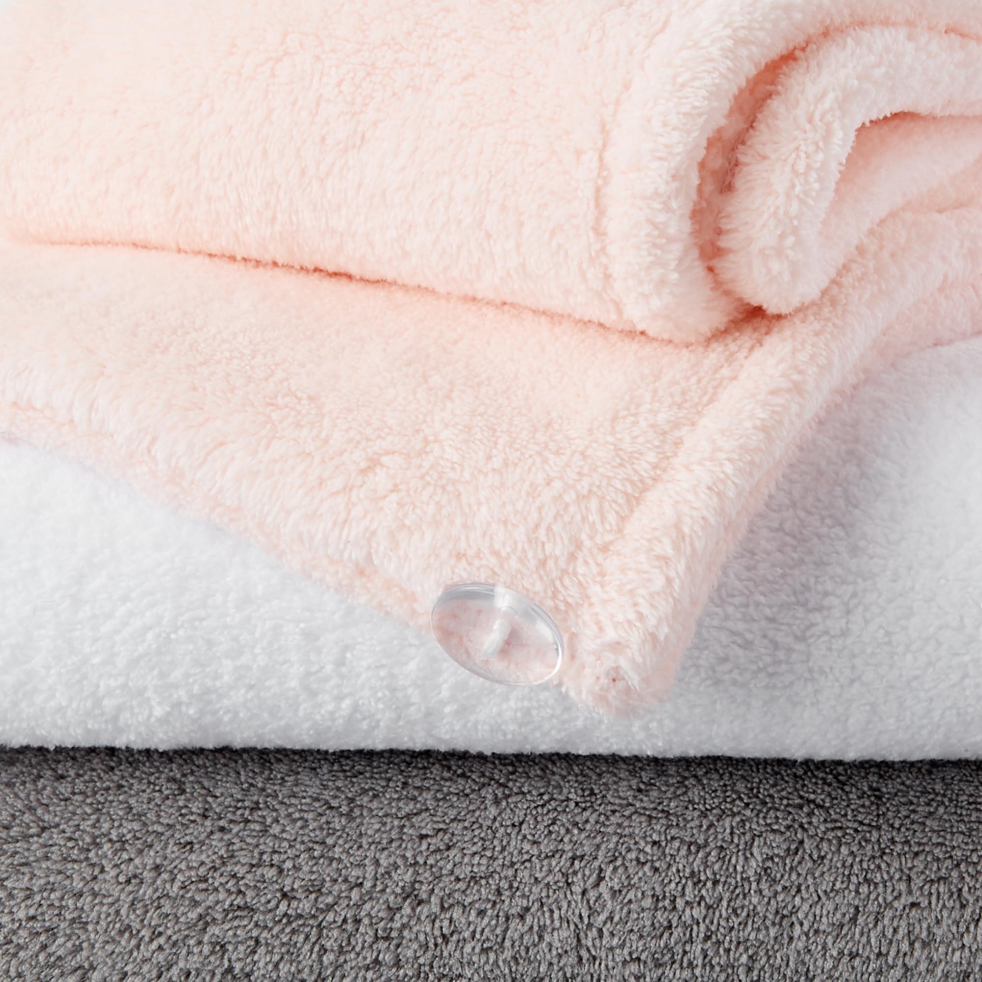 Person wearing Amazon Basics towel wrap secured with elastic band for convenience