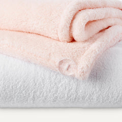 Amazon Basics towel wrap worn on head in bathroom showing hands-free drying convenience