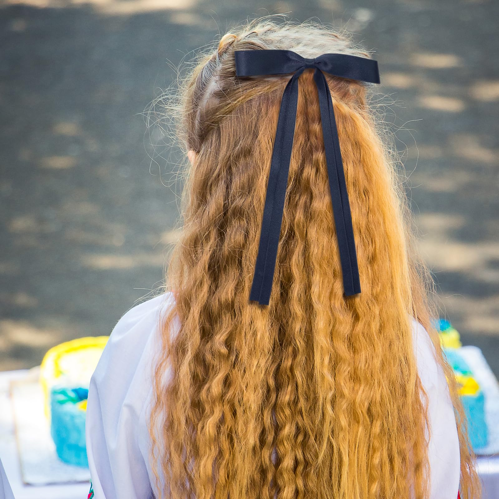 Ambesi bow woven into braid illustrating added volume and decorative flair