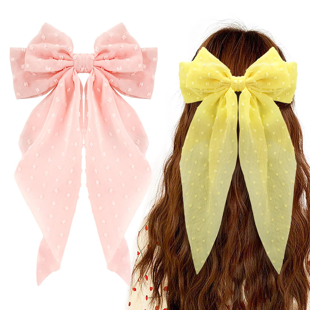Ambesi front view of pink and yellow bow barrettes showing decorative design and appeal