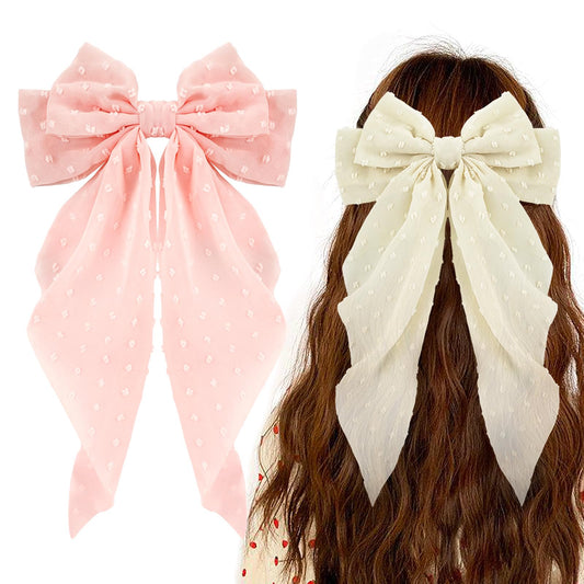 Ambesi front view of two bows showing pink and beige, adds elegant style