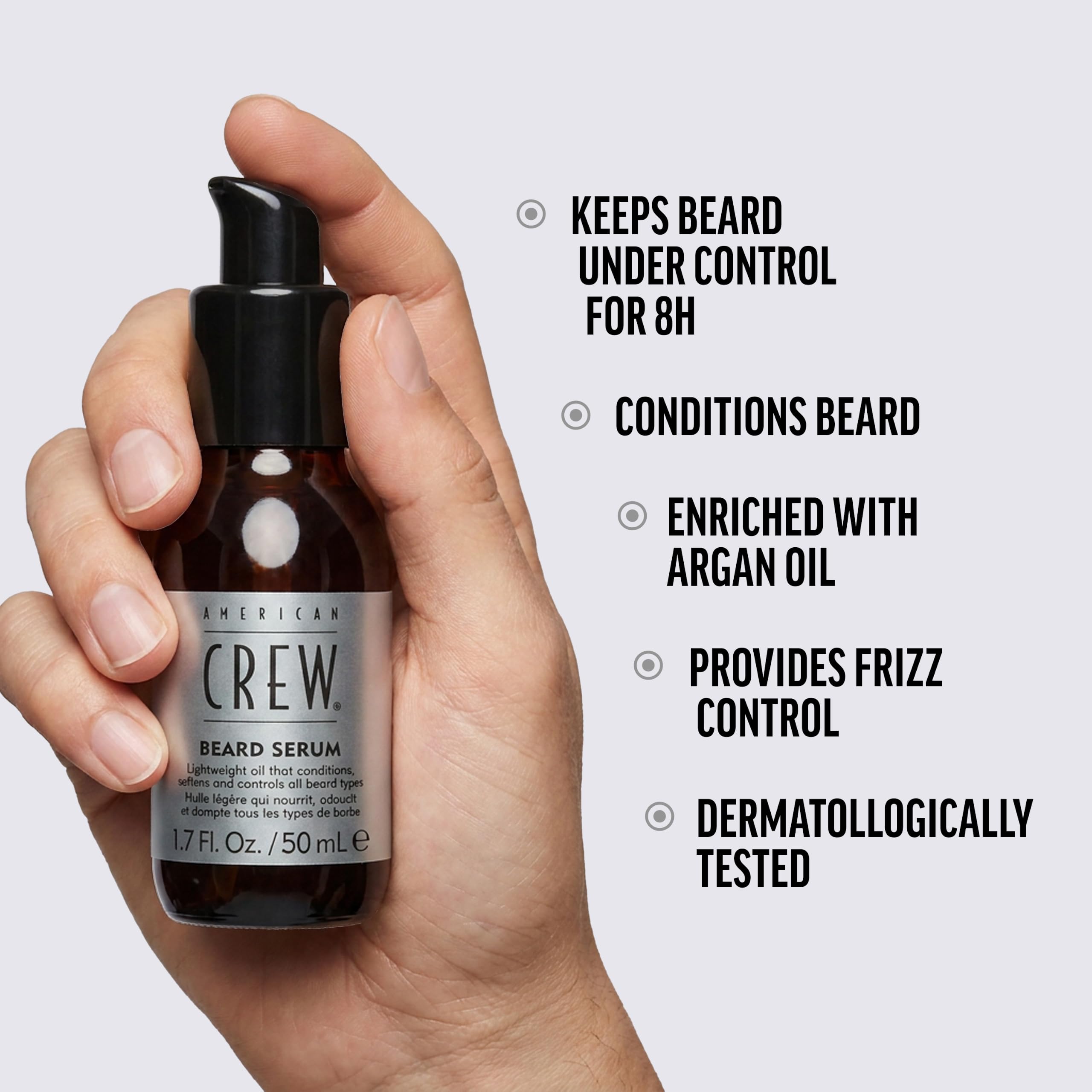 American Crew serum in palm being warmed for even distribution benefit