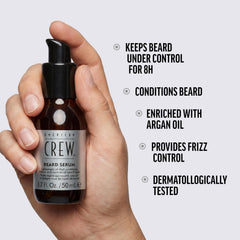 American Crew serum in palm being warmed for even distribution benefit