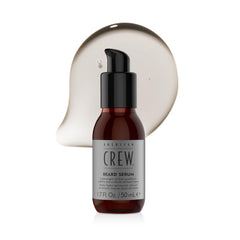 American Crew serum applied while combing beard to demonstrate improved manageability