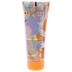 amika Supernova near a hand for scale to show compact 3.3 fl oz travel-friendly size