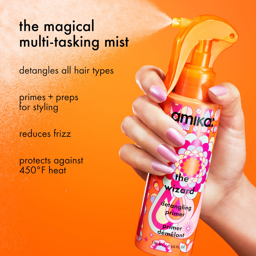 amika The Wizard mist spraying to demonstrate even coverage and easy application
