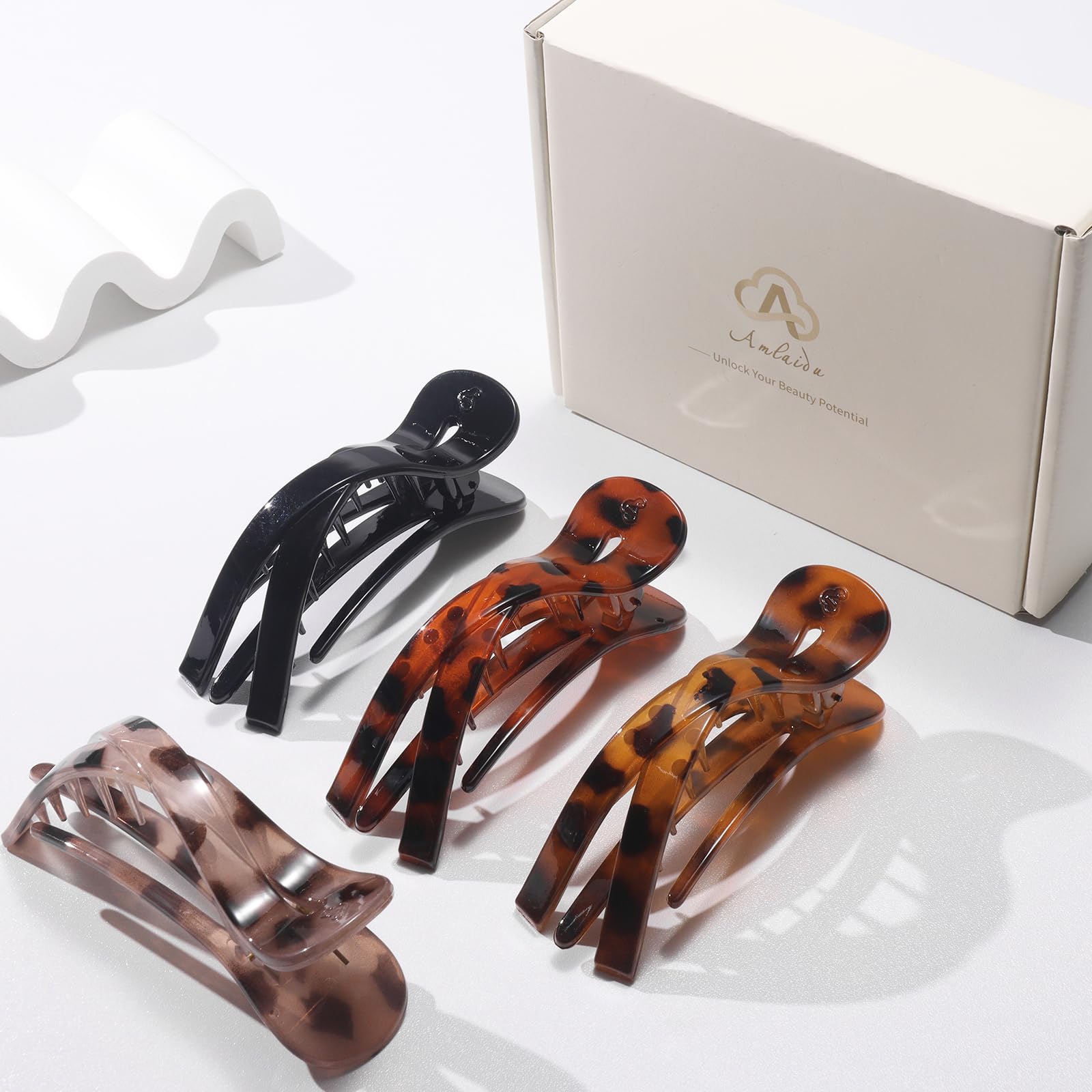 Amlaidu packaging with four clips displayed indicating ready-to-gift convenience