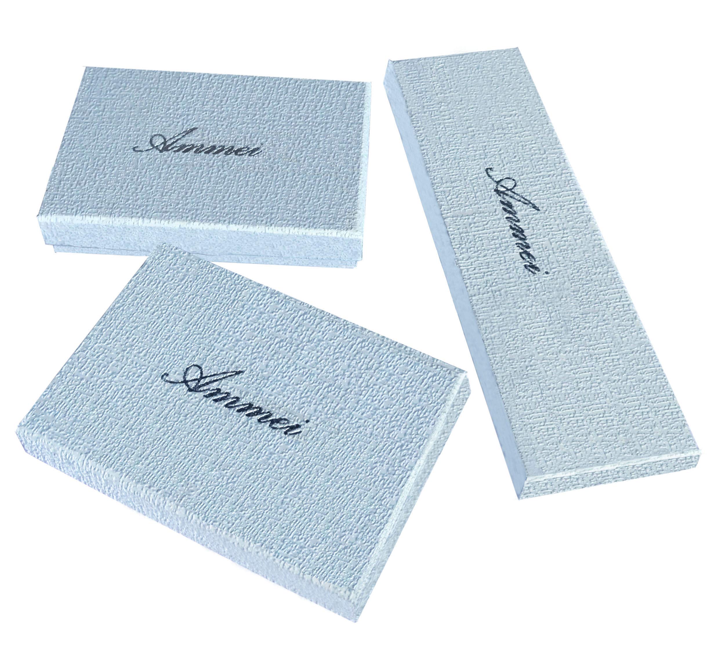 Ammei Headpiece group arrangement on fabric showing cohesive set and versatility
