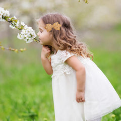 Amybasic toddler wearing gold clip adding sparkle and gentle grip