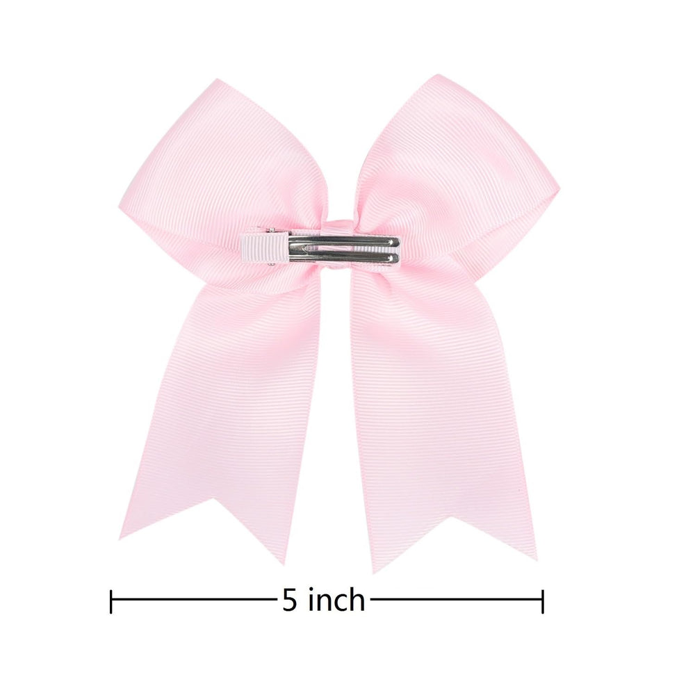 AMYDECOR bow worn in ponytail showing in-use stability benefit: stays put during play