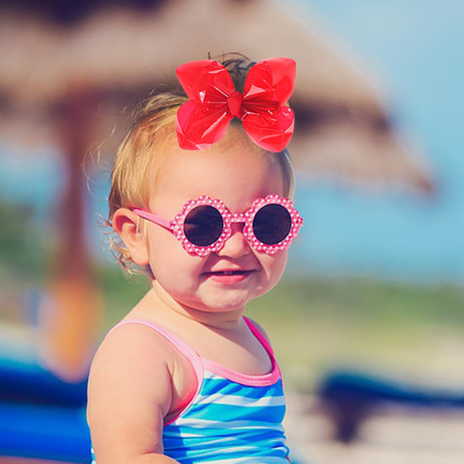 AMYDECOR red bow clipped in a little girl's hair offering playful summer style