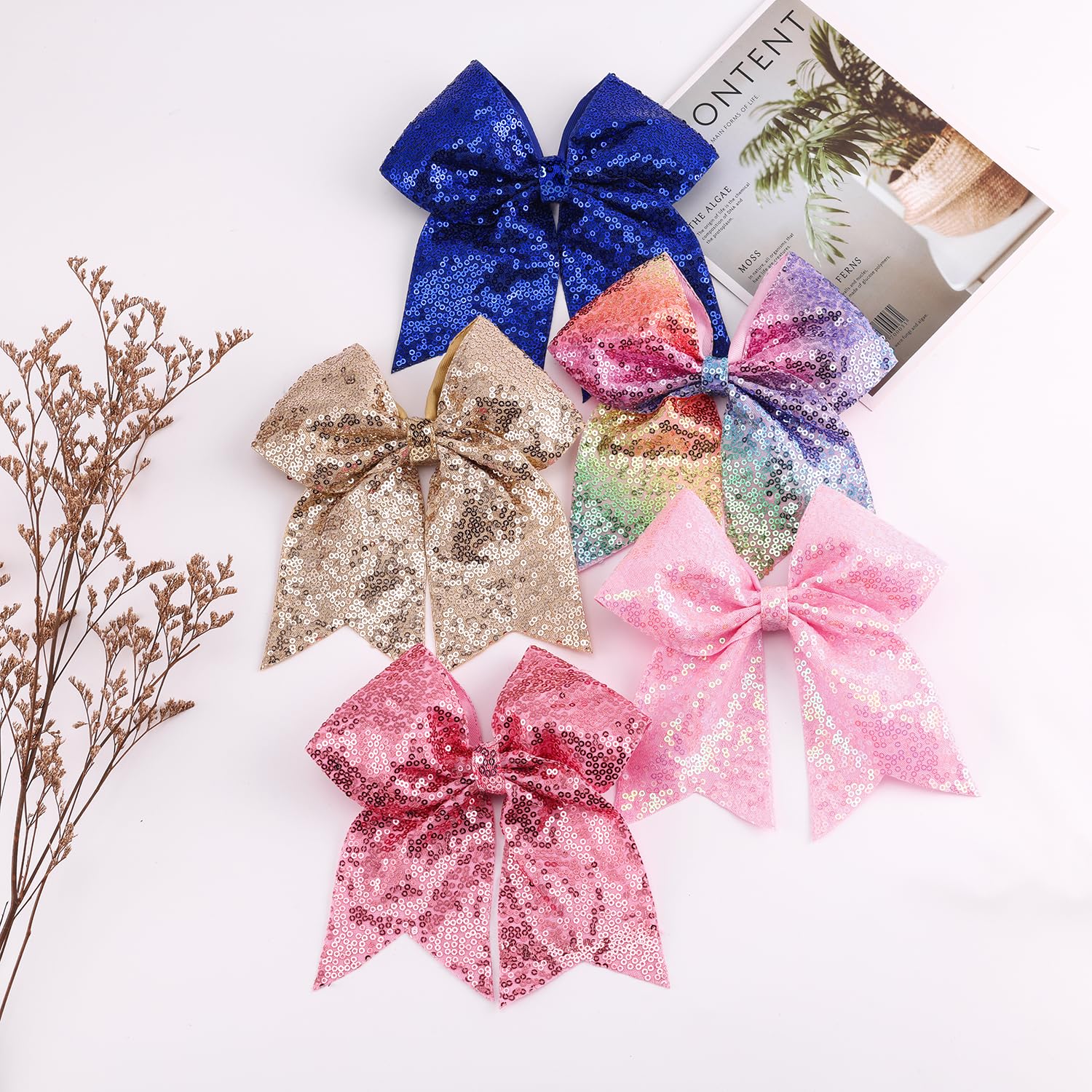 AMYDECOR bow held in hand for size comparison and visible scale