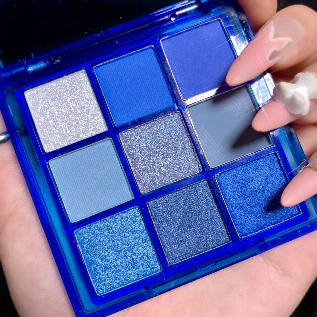 AMY'S DIARY palette in use applying navy shimmer on eyelid for long-lasting color