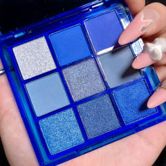 AMY'S DIARY palette in use applying navy shimmer on eyelid for long-lasting color