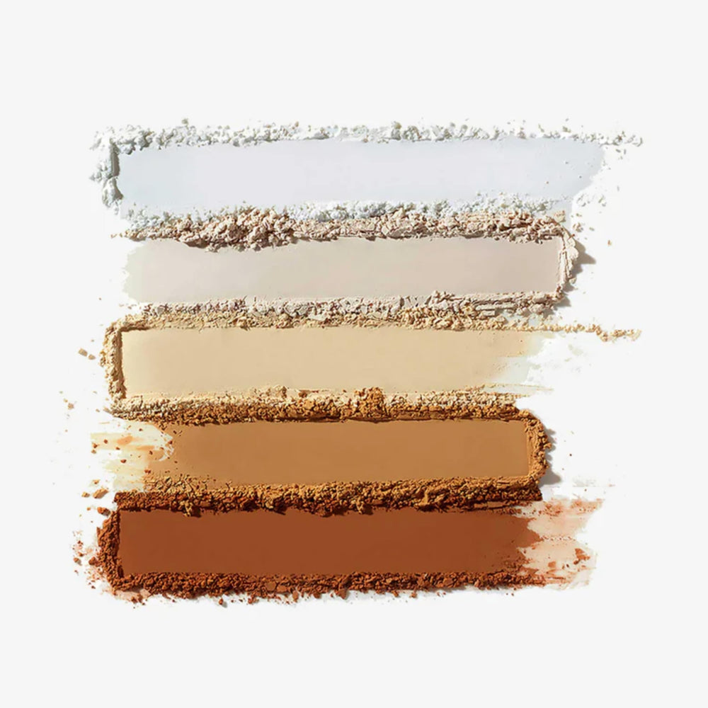 Anastasia Beverly Hills powder in use pressed under eye to reduce shine and creasing