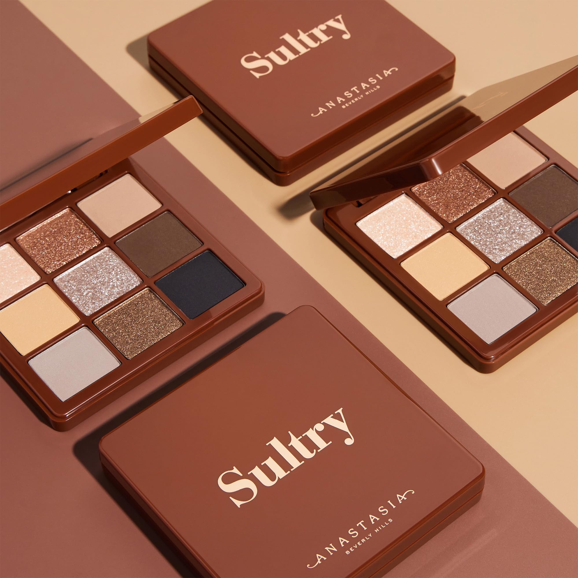 Anastasia Beverly Hills eyeshadow being picked up with a brush for controlled application