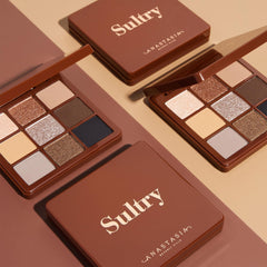 Anastasia Beverly Hills eyeshadow being picked up with a brush for controlled application