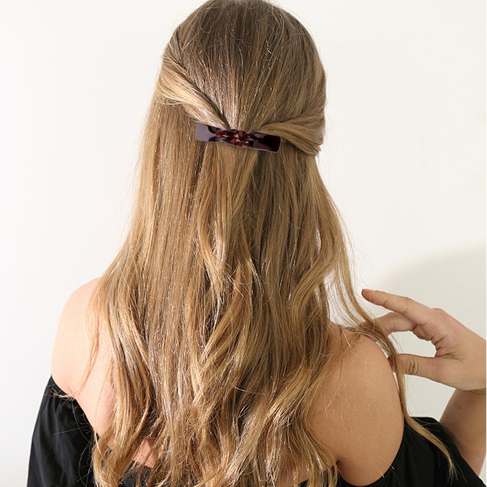 ANBALA clips in hand to show scale and lightweight convenience