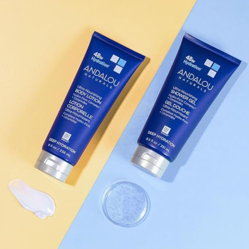 Andalou Naturals 8 fl oz next to a hand to show true product size