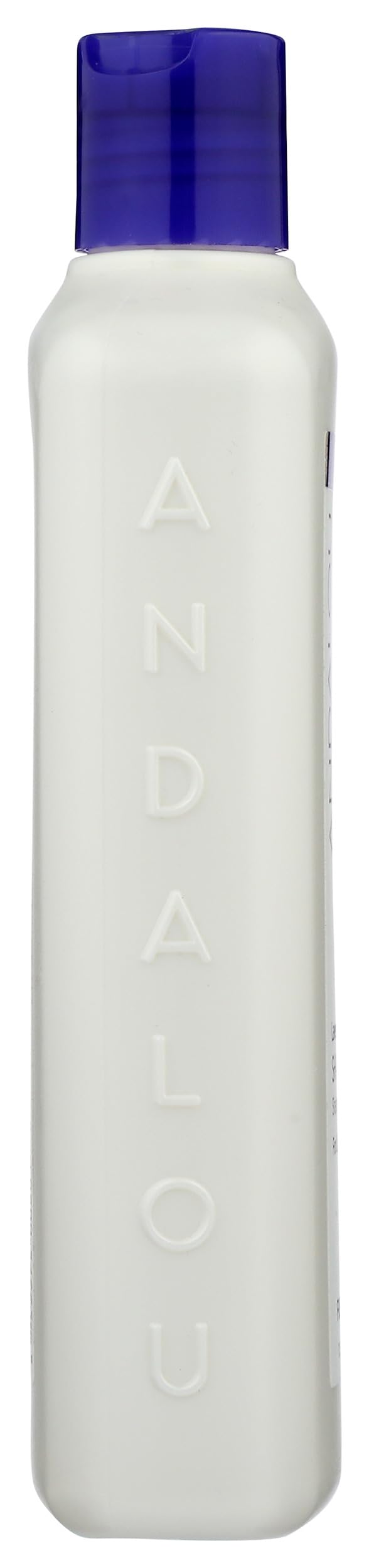 Andalou Naturals shampoo poured into bowl showing lightweight consistency and easy use