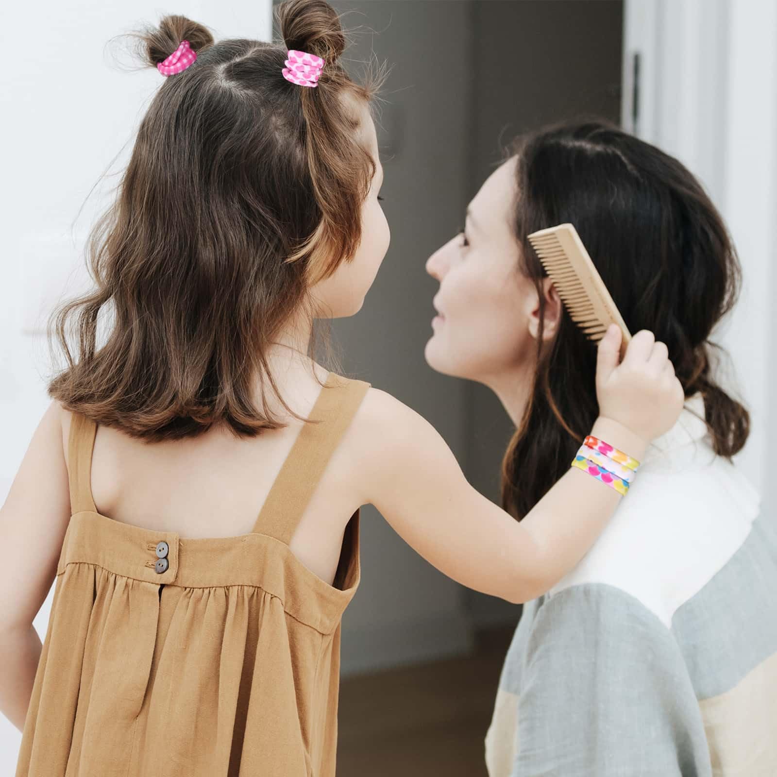 anezus child wearing matching ties showing playful, secure styling