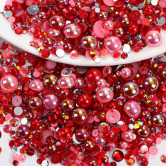 Anower front pack showing mixed red rhinestones and pearls for crafting