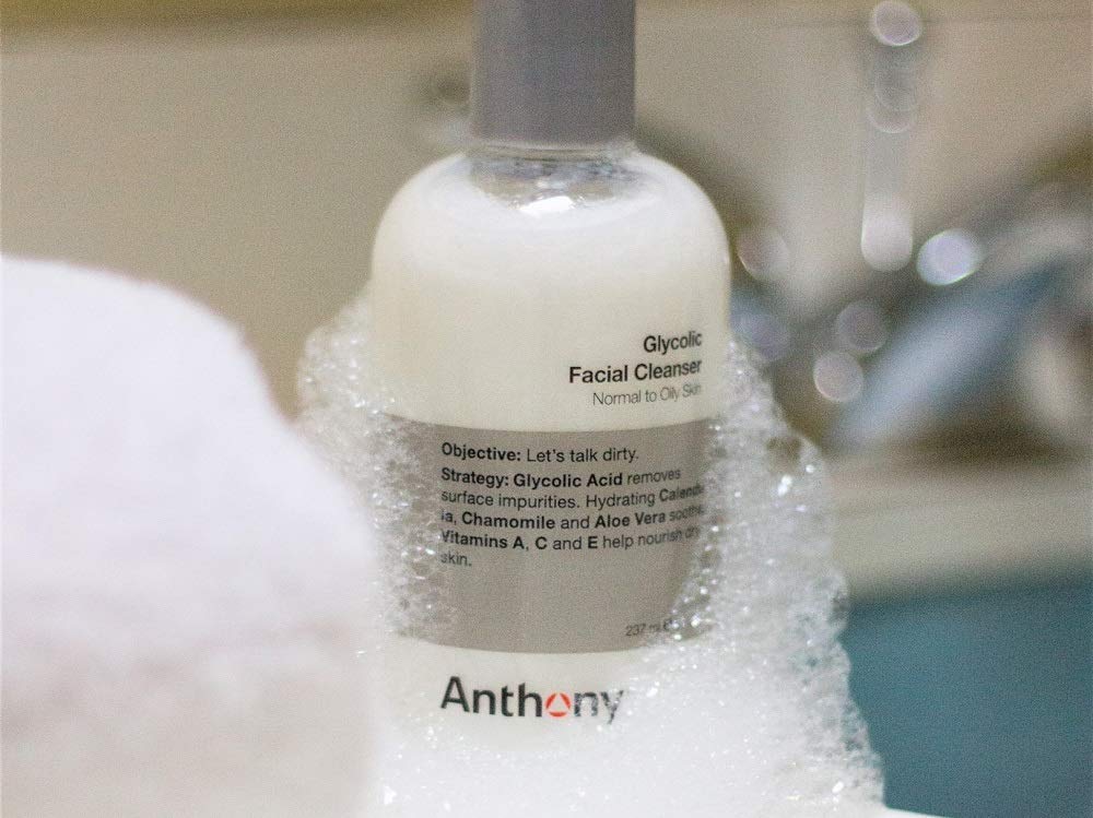 Anthony Glycolic 16 fl oz bottle beside common objects showing travel-ready size benefit