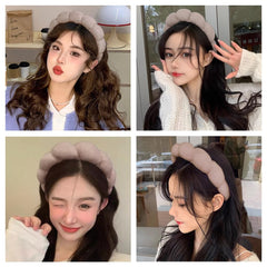 AOENJIE headband next to hand showing compact size and portable convenience