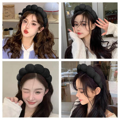 AOENJIE headband held in hand showing compact size for easy storage