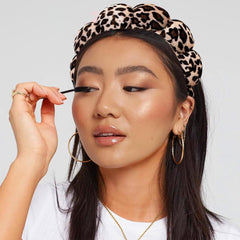 AOENJIE headband next to ruler showing compact size and travel-friendly benefit