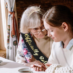 AOPRIE tiara on hand scale comparison showing lightweight portability