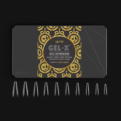 APRÉS hand holding several Gel‑X tips showing extra long scale and length