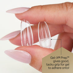 APRÉS Gel-X Prep bottle in hand showing 15 ml compact scale for travel and kit use