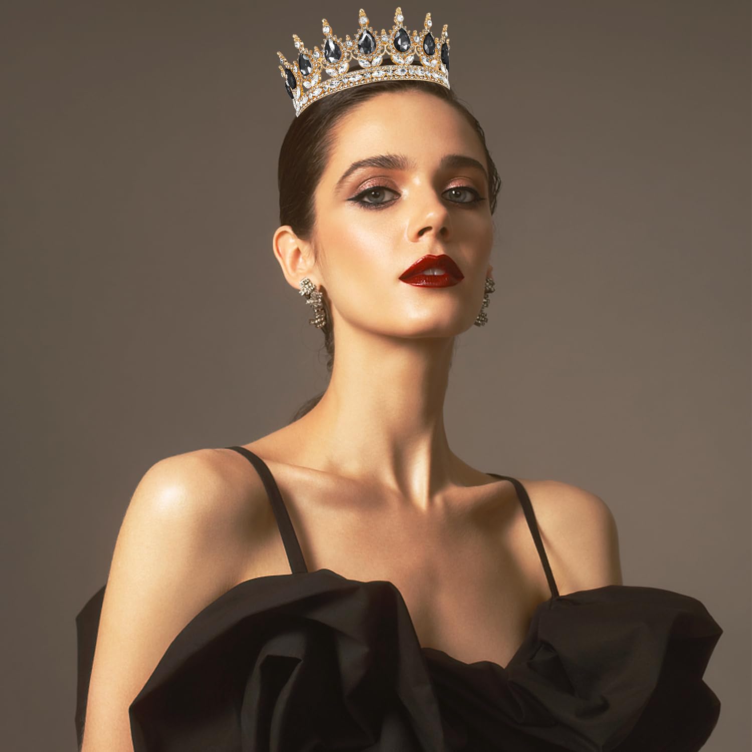 Aprince tiara held in hand to show size and lightweight comfort