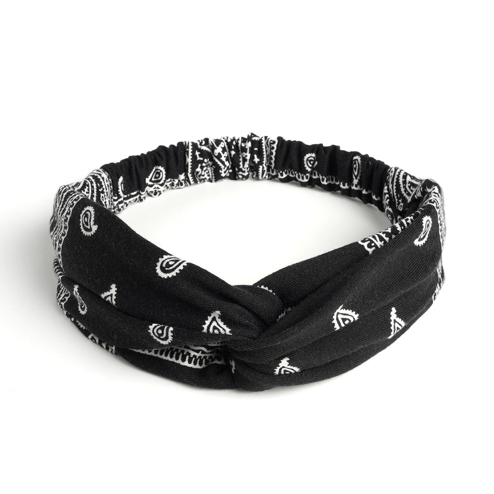 AQOKKA close-up of knotted crisscross detail highlighting chic boho look