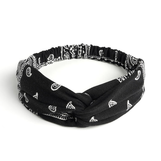 AQOKKA close-up of knotted crisscross detail highlighting chic boho look