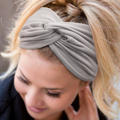 AQOKKA headband in use during workout showing non-slip hold and hair control